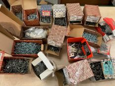 A selection of boxed nails and screws