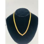 A 14 ct gold necklace (22.9g)