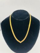 A 14 ct gold necklace (22.9g)