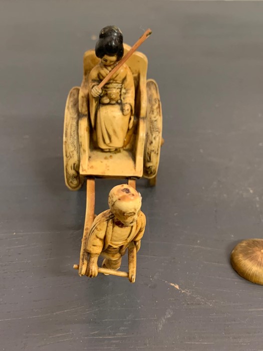 An ivory/resin figure of a boy pulling a rickshaw - Image 2 of 4