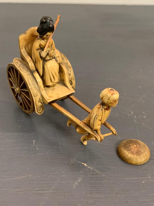 An ivory/resin figure of a boy pulling a rickshaw - Image 3 of 4