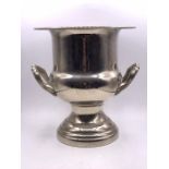A silver plate ice bucket.