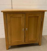 A small oak two door cupboard (H65cm W65cm D33cm)