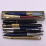 A small collection of pens, various makers