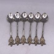 A Set of Six White Metal teaspoons.