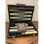 A Bach Gammon set in suede case