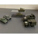 Four military tanks and two military vehicles