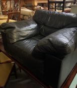 A Heal's Leather over sized armchair.