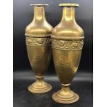 A pair of brass mantle vases