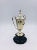 An engraved, hallmarked silver trophy (75g) on stand
