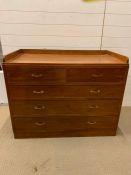 A wide chest of drawers with two over three and brass handles (H86cm W106cm D56cm)