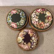 A selection of three tapestry footstools.