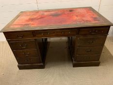 A mahogany pedestal desk with red leather top and drawers to side (H76cm W137cm D81cm)