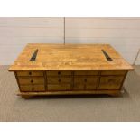 A pine coffee table with drawers to side (118cm x 66cm)