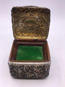 A Silver musical box on ivory feet, hallmarked Birmingham 1891