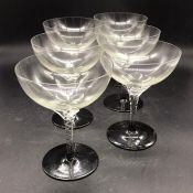 Six glass champagne coupes with twisted stems