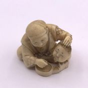 An Ivory Netsuke signed to base