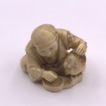 An Ivory Netsuke signed to base