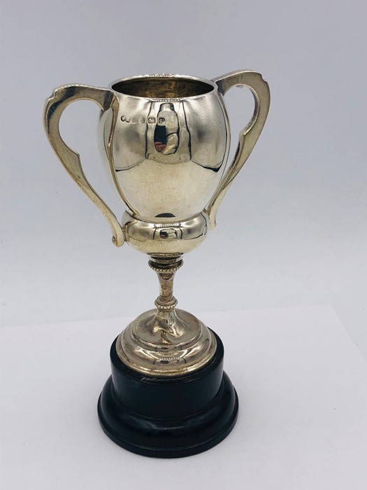 A Hallmarked silver trophy, engraved on stand. (84g)