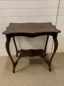 A mahogany side table with scrolled edge and shelf under (H76cm W77cm D50cm)