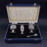A Boxed set of Silver (EWH makers marks) cruets Birmingham hallmark 1948