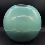 A turquoise glazed vase