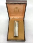 A Dunhill Lighter in original box with guarantee.