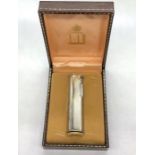 A Dunhill Lighter in original box with guarantee.