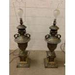 A pair of brass urn table lights