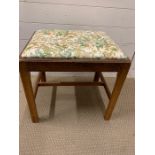 An oak dressing table stool