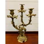 A Three arm brass candelabra