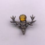 A Scottish Cairngorm and Stag themed brooch