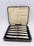 A Boxed set of silver and mother of pearl knives, IE & S makers mark, Sheffield 1924.