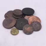 A 1772 George III brass coin weight and a quantity of worn Georgian coins, including cartwheel