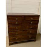 A mahogany chest of drawers with hoop handles and bracket feet (H116cm W113cm D55cm)