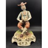 A Capodimonte figure of a country man