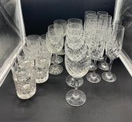 A selection of cut glass champagne wine and tumbler glasses