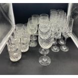 A selection of cut glass champagne wine and tumbler glasses
