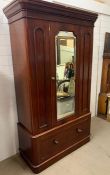 A 1900's mahogany wardrobe with mirror to door and large drawer to base (H203cm W113cm D50cm)