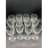 Twelve wine glasses with bobble steams