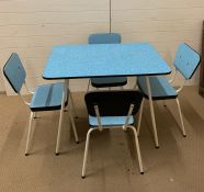 A vintage Retro dining table and chair with metal legs and blue top