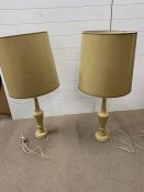 A pair of tall turned wood lamps