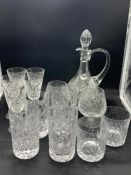 A selection of cut glass decanters including tumblers and wine glasses