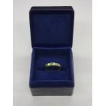 An Emerald and Diamond Half Eternity Ring