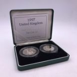 A 1997 2 x 50 p Silver Proof coin set old 50p and New 50p.