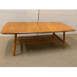 A 1960's Ercol Elm coffee table (H37cm W105cm)