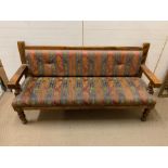 A bench seat with wooden frame (H148cm W180cm D57cm)