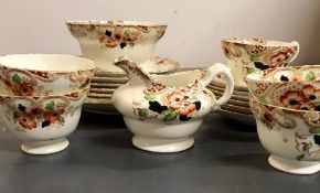 A floral part tea set consisting of tea cups and saucers, side plates etc