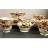 A floral part tea set consisting of tea cups and saucers, side plates etc