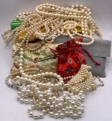 A Large volume of pearl necklaces in various styles and fashions with various makers.